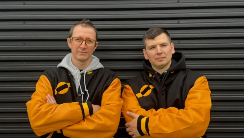 SpaceComputer and Spacemanic founders in mission jackets