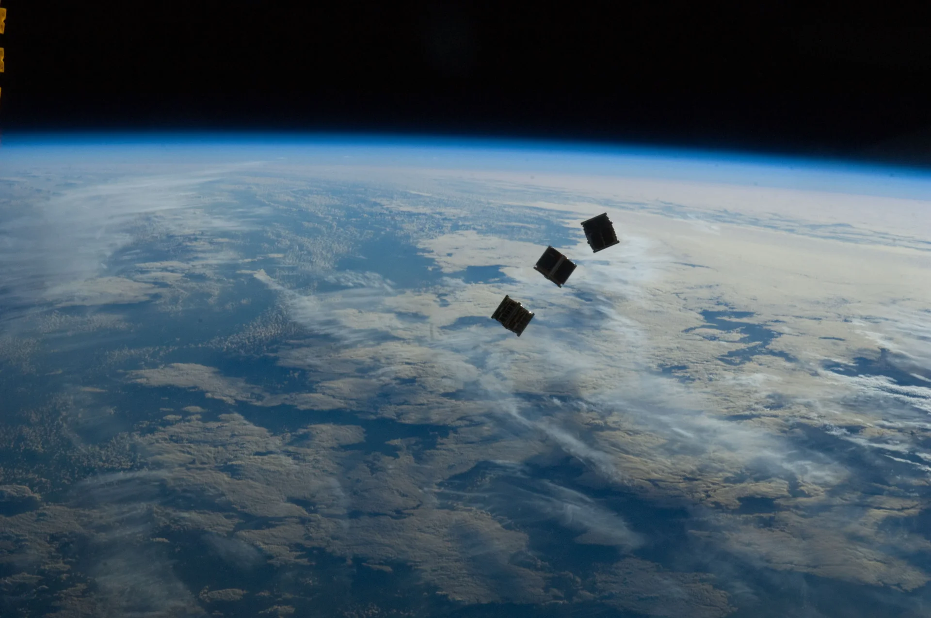 Satellites orbiting Earth from space